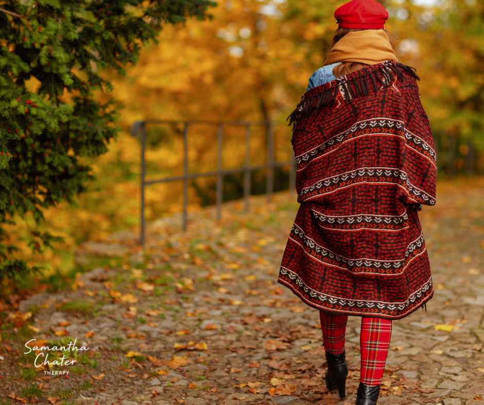 A person walking slowly outdoors, reflecting the emotional shifts and anxiety that often appear in midlife.